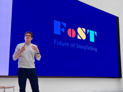 Person speaks at the launch event.
(FoST Future of StoryTelling,business, internet, people, man, technology, education, paper, indoors, writing, creativity, isolated, contemporary, computer, achievement, display, screen, empty, television, spherical, facts)