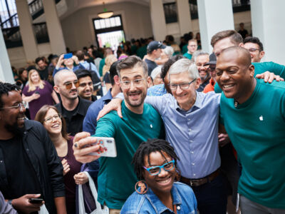The crowd cheers as the new iphone x is launched.
(street, people, rally, group, woman, police, administration, crowd, education, man, festival, landscape, music, adult, school, flag, university, many, election, family)