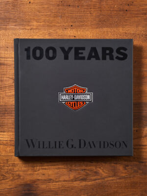 The book of the year.
(IOOYEARS MOTOR HARLEY-DAVIDSON CYCLES WILLIE GDAVIDSON,no person, wood, retro, paper, business, empty, dirty, knowledge, chalk, handwritten, education, achievement, writing, dark, graphic design, conceptual, warning, facts, old, strategy)