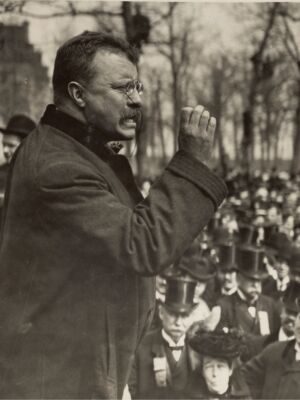 Politician, speaking to a crowd.
(people, adult, portrait, man, administration, two, one, leader, monochrome, street, group, wear, group together, elderly, profile, music, war, many, outfit, actor)