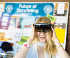 A woman wearing virtual reality glasses in front of a school.
(Futute of toviellr,eyeglasses, woman, indoors, student, sunglasses, contemporary, fashion, college, shopping, pretty, looking, research, intelligence, machinery, eyewear, adolescent, family, eye, education, knowledge)