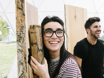 A couple of friends hanging out in the woods.
(WAOAN,man, fun, people, family, portrait, woman, looking, togetherness, fine-looking, love, indoors, business, funny, college, adult, wear, achievement, leisure, laughing, enjoyment)