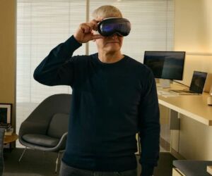 Man wearing virtual reality glasses in a conference room.
(man, eyeglasses, eyewear, indoors, portrait, sunglasses, lens, one, people, adult, fashion, room, wear, video, technology, model, concentration, looking, mirror, serious)