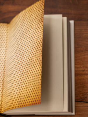 Book on a wooden table.
(no person, paper, empty, retro, textbook, wood, knowledge, education, indoors, literature, facts, stacks, book bindings, business, contemporary, leather, rough, dirty, interior design, antique)